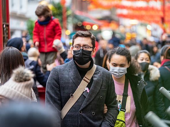Crowd of people wearing anti-viral masks